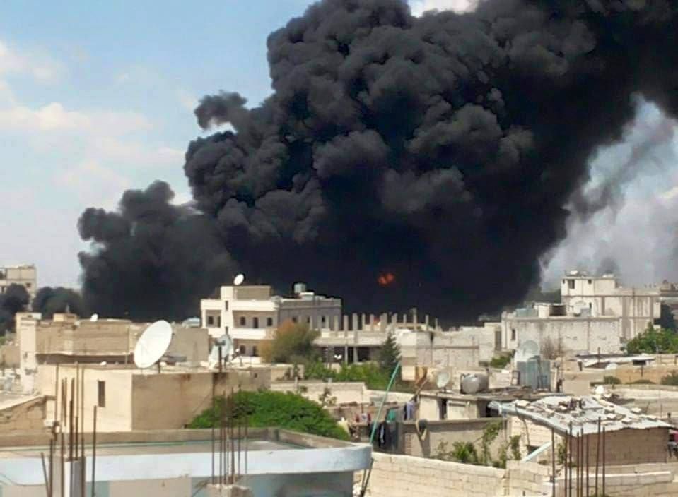 Smoke bellows from Manbij following alleged Coalition strikes on June 22nd (via SO4HR)
