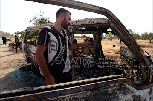 Man standing in the location where the US forces operation killed al-Baghdadi in Barisha village in Idlib on 26/27 October 2019 (via SMART).