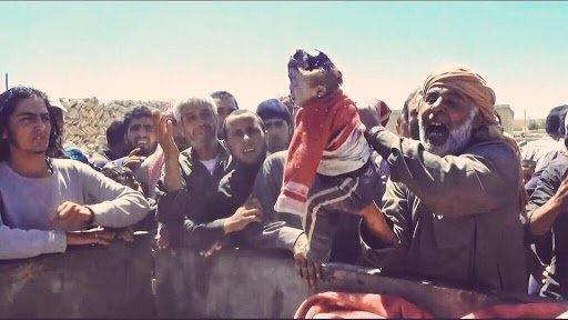 A series of stills from a video published by ISIS-affiliated media showing very graphic imagery of the dead a large proportion of them children. The video itself has been removed from youtube. [Via: SN4HR report published on May 6th 2015]