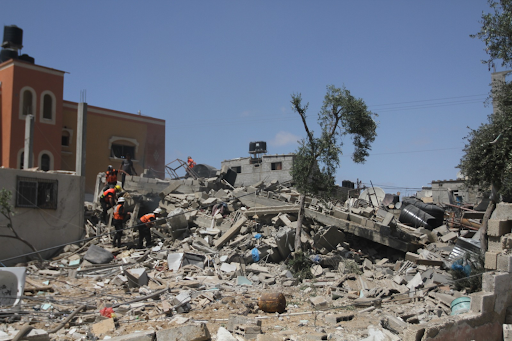 People look through the rubble of a house reportedly destroyed in an Israeli airstrike May 20 2021 in Shaboura, Gaza. Image posted on Twitter by @Alaqsavoice_Brik.