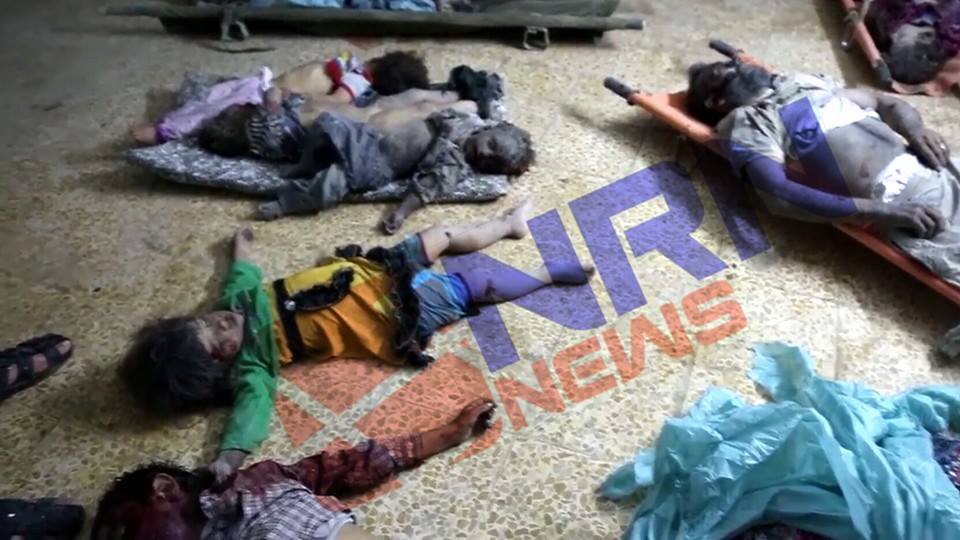 An image shows the children bodies on the floor that killed in an alleged coalition strike at Tal Afar, May 5th 2016 (via NRN)