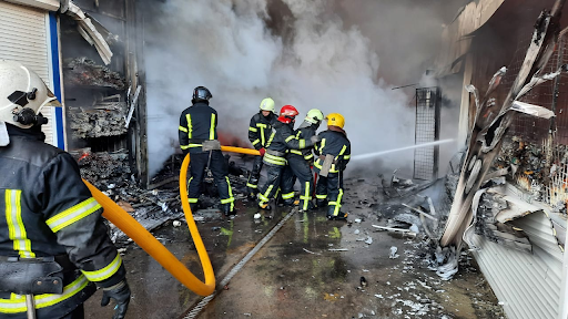 Rescue workers put out a fire at the market in the Heroiv Pratsi on March 16, 2022. (Image posted by DSNS via Telegram)