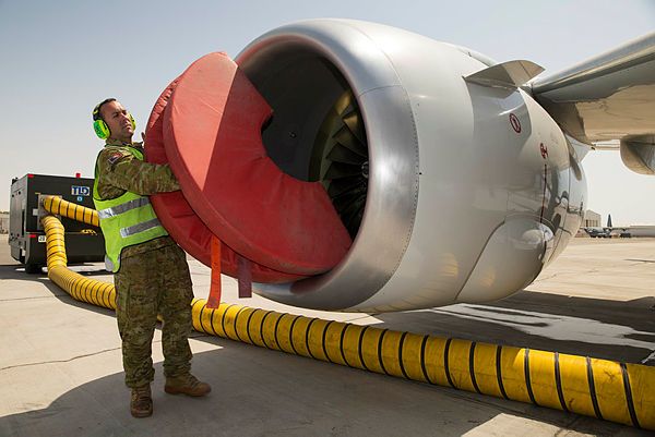 Air Task Group E-7A Detachment (Task Element 630.1.2) Rotation Six Aircraft Maintainer, Leading Aircraftman Lee Childs, removes engine protectors from a Royal Australian Air Force E-7A Wedgetail aircraft, prior to an inspection, at Australia’s main support base in the Middle East region. (Aus MoD)