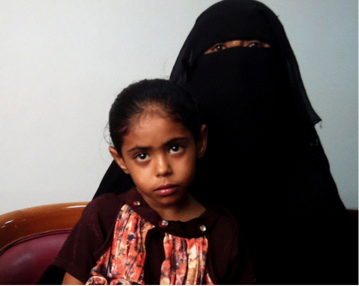 Nada Mobqil Loqyah, 5, with her guardian Salaha Moqbil Loqyah. Nada was orphaned in the 2009 strike on al-Majalah. (via Human Rights Watch, 2013)