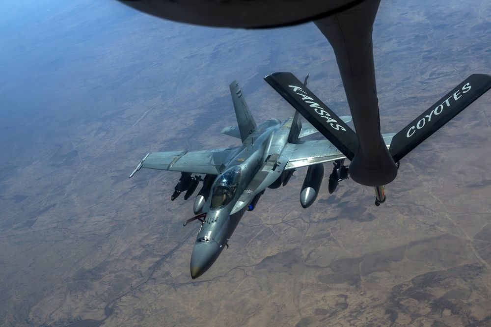 A Royal Australian Air Force F/A-18 Super Hornet flies behind a U.S. Air Force KC-135 Stratotanker for aerial refueling in support of an Operation Inherent Resolve mission Feb. 22, 2017 (U.S. Air Force photo by Staff Sgt. Matthew B. Fredericks) 
