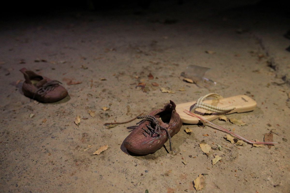 Shoes of victims are seen at the scene of a Turkish attack, according to Iraqi officials, on a mountain resort in Iraq's northern province of Dohuk, Iraq, July 20, 2022. REUTERS/Ari Jalal