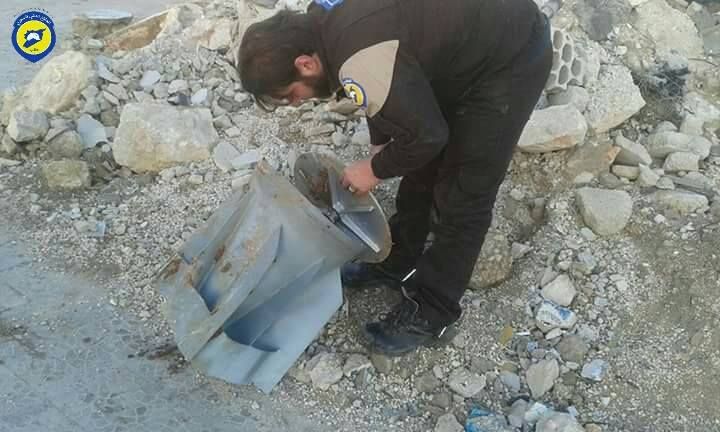 A member of the White Helmets examines the remains of a cluster bomb fired on Mare', 29th Jan. (via White Helmets)