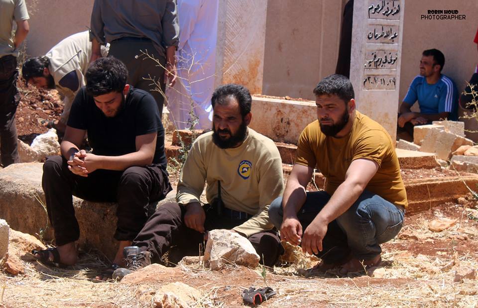 Civil Defence members mourn their friends who were killed by Russian warplanes in Turmanin on 11th July 2016.