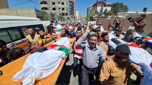 Funeral for the 10 women and children killed in Israeli strikes on Al Shati camp on May 15th, 2021. (Image posted by @RassdNews)
