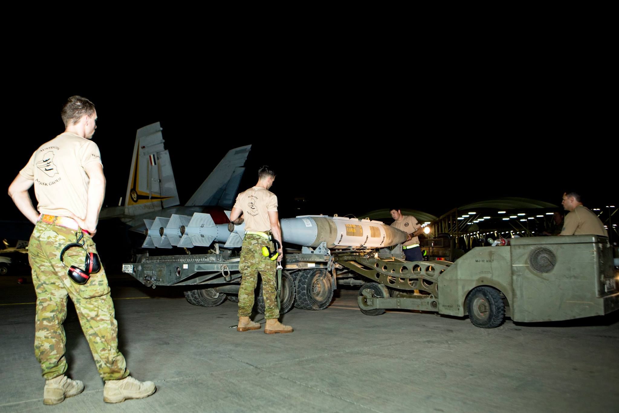 Australian armament personnel assemble and load weapons (image via CJTF OIR)