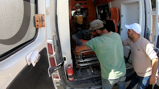 Civil Defense volunteers treat the victims of a bombing of Al-Tuffahiya on October 11, 2021. (Image posted by Syrian Civil Defense)