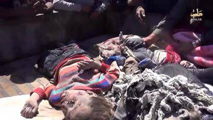 A series of stills from a video published by ISIS-affiliated media showing very graphic imagery of the dead a large proportion of them children. The video itself has been removed from youtube. [Via: SN4HR report published on May 6th 2015]