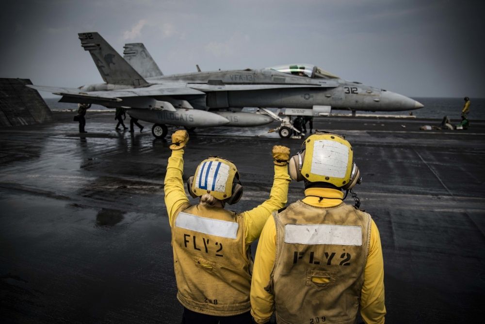 An F/A-18C Hornet prepares to launch from the flight deck of the aircraft carrier USS Dwight D. Eisenhower, Nov 24th (US Navy)