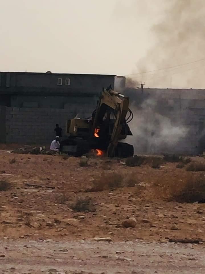 A digger on fire after alleged LNA or UAE drone strikes on Al Qaddahiyah, May 11th 2020 (via Burkan Al Ghadab Operation).