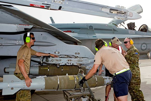 Deputy Commander Joint Task Force 633, Brigadier Neil Sweeney (right), chats with Air Task Group Strike Element Line Safety Controller, Warrant Officer Adam Smith, during a tour of the flight line at Australia's main air operating base in the Middle East Region. (Aus MoD)