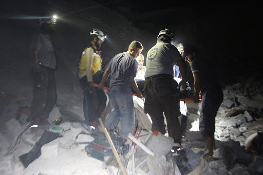Syrian Civil Defense volunteers rescuing civilians and pulling bodies out of the rubble in Zardana after alleged Russian airstrikes on June 7th, 2020 (via SCD)