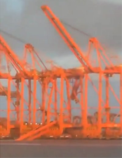 Visible: crane damaged and hanging down unsupported