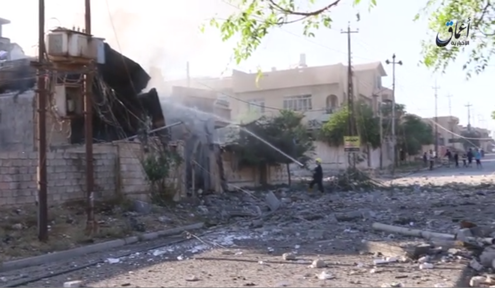 Screenshot from al A'amaq video showing destroyed buildings. Later footage shows victims.