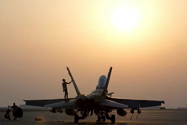 An Air Task Group Strike Element member conducts maintenance on a Royal Australian Air Force F/A-18A (Aus MoD)