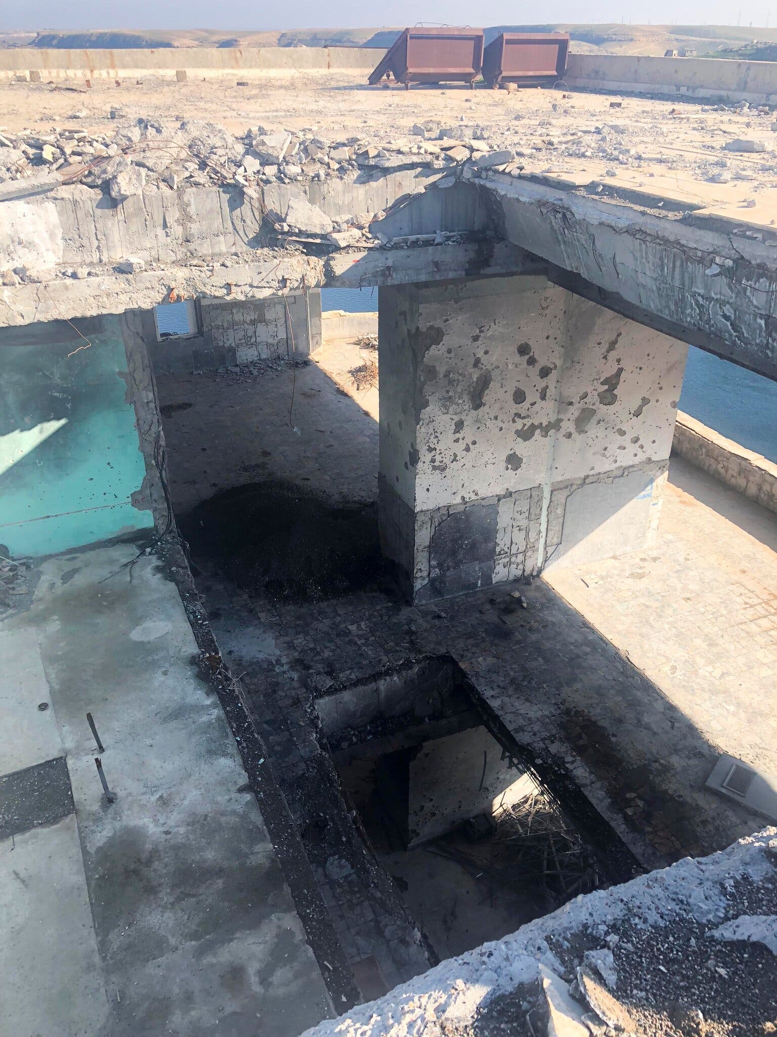 A coalition missile penetrated five stories of the dam’s north tower. Two missiles on the southern tower penetrated three floors down.Credit...Azmat Khan/The New York Times