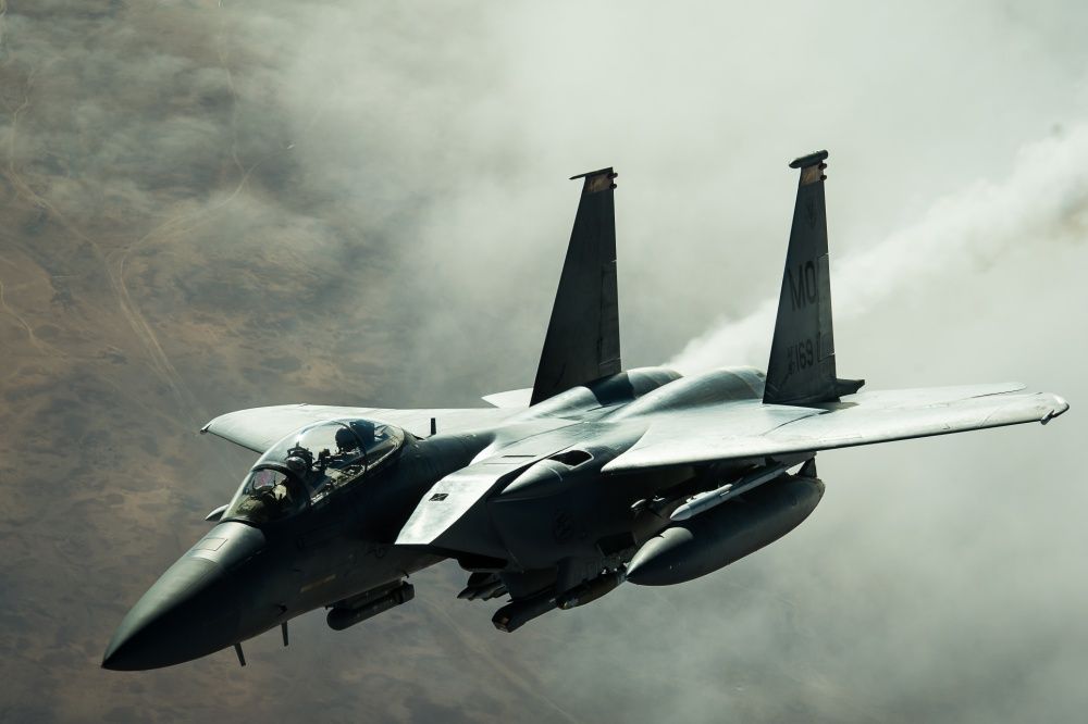 A USAF F-15E Strike Eagle disconnects from a USAF KC-10 Extender after receiving fuel over Iraq, Dec 5th (US Air Force)