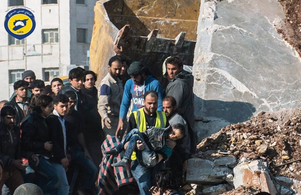 The White Helmets removed the body of a child from the rubble following an alleged Russian airstrike on Atareb, Dec 12th (via White Helmets)