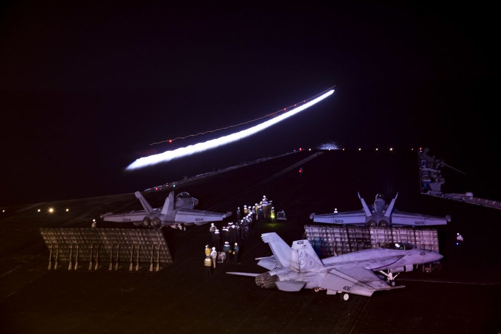Two E/A-18G Growlers and an F/A-18E Super Hornet prepare to launch from USS Dwight D. Eisenhower, Oct 17th (US Navy)