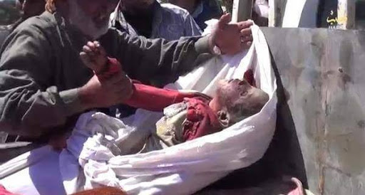 A series of stills from a video published by ISIS-affiliated media showing very graphic imagery of the dead a large proportion of them children. The video itself has been removed from youtube. [Via: SN4HR report published on May 6th 2015]