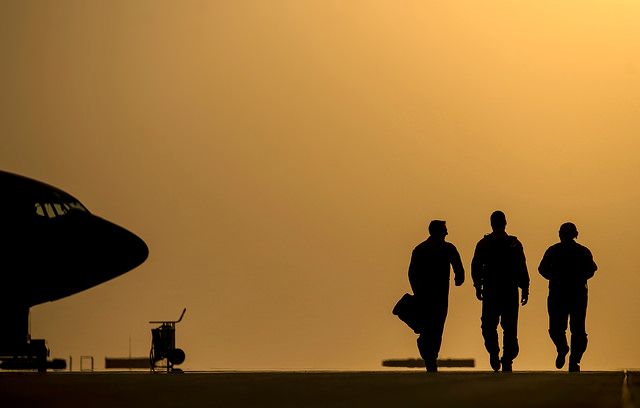 Aircrew approach their KC-135 aircraft for a refueling mission over Iraq, Aug. 11, 2014.  (USAF/ SSgt. Vernon Young Jr)