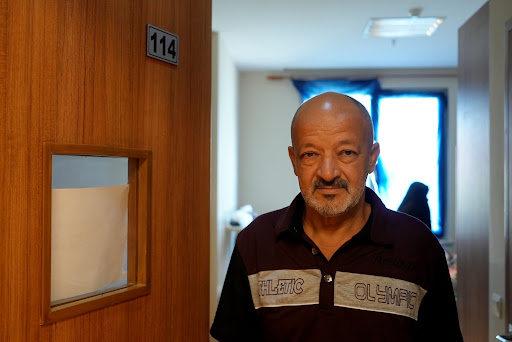 Abu Mustafa outside Aseel Fadhal's room in Zakho General Hospital (MEE/Azhar Al-Rubaie)