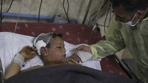 Mahmoud Qasoum was was reported seriously injured in a US strike in Idlib December 3rd 2021. Image published by Associated Press/Ghaith Alsayed.
