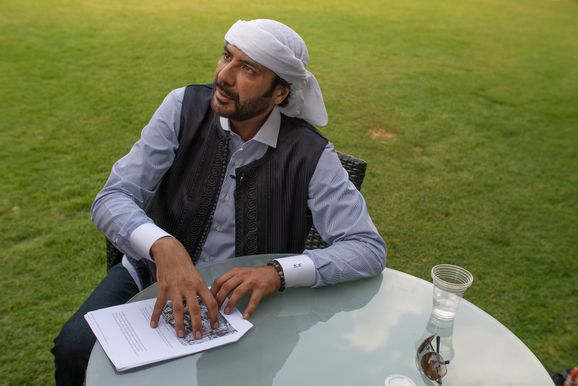 Khaled al-Hameidi reviews the document which shows Danish planes were involved in the strikes which killed his family (Hamada Elrasam/Airwars/Altinget 2023)