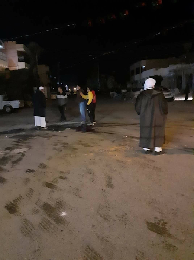 Civilians standing in the location where a mortar had landed earlier in Manshiya in Sabha and led to the death of a child and the injury of up to 30 others including children. (via Sabha News).