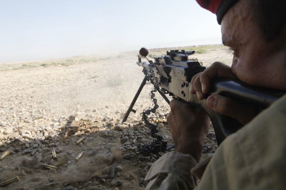 An Iraqi soldier fires a Pulemyot Kalashnikova machine gun during squad automatic weapons training at Camp Taji, Iraq (US Army)