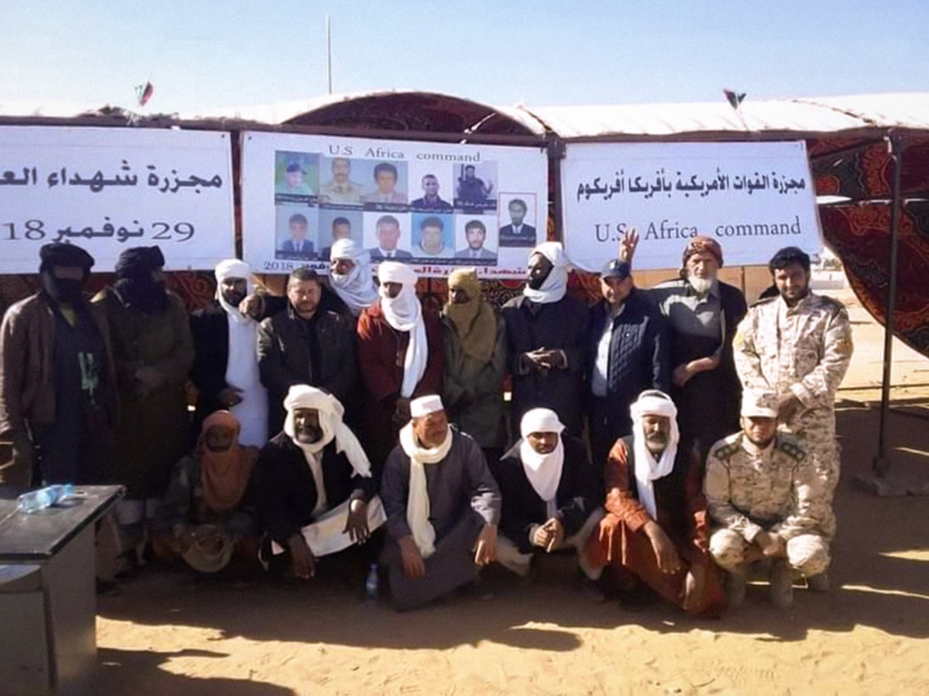 The Taureg community protests drone strikes by U.S. AFRICOM in the region while holding a banner showing the photographs of their community members killed in a November 2018 lethal strike. Photos: Courtesy of Reprieve