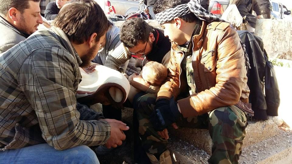 The baby Ahmad Hamza Layla is removed from rubble in Anadan after an alleged raid by regime forces, according to SN4HR (via SN4HR)