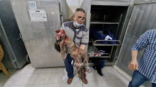 Very graphic image of a child allegedly killed in strikes on Al Jeniya neighborhood on May 13, 2021. (Image posted by Paltoday News)