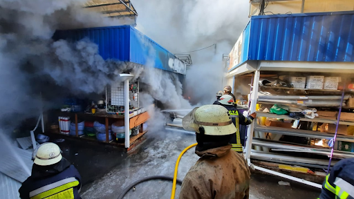 Rescue workers put out a fire at the market in the Heroiv Pratsi on March 16, 2022. (Image posted by vgorode.ua)