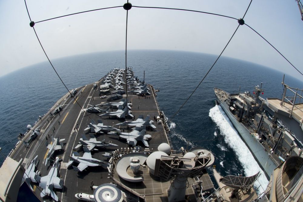 The aircraft carrier USS Dwight D. Eisenhower (CVN 69) (Ike) pulls alongside the fast-combat support ship USNS Arctic (T-AOE 8) to conduct a replenishment-at-sea (US Navy)