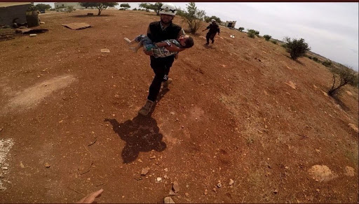 A SCD volunteer moving body of a civilian killed in Abdin, Idlib on Sep 9th, 2018 (via voiceofsunnis)