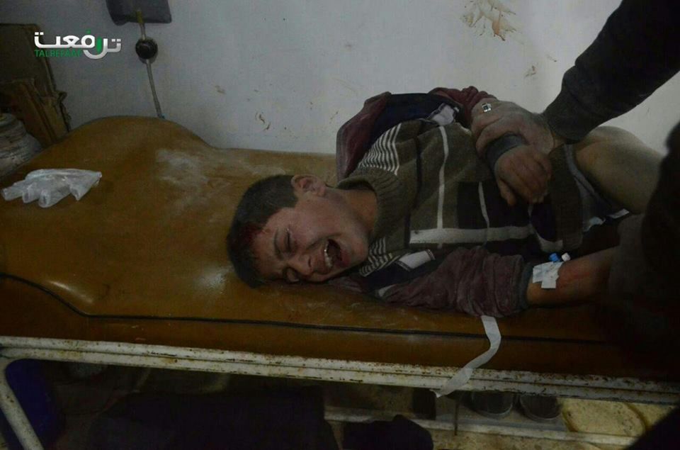A child writhes in agony following alleged airstrike on Tal Rifa'at, Dec 28th (via SNN)