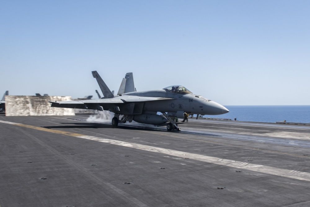 An F/A-18E Super Hornet assigned to the “Pukin’ Dogs” of Strike Fighter Squadron (VFA) 143, launches from the flight deck of aircraft carrier USS Harry S. Truman [US Navy]