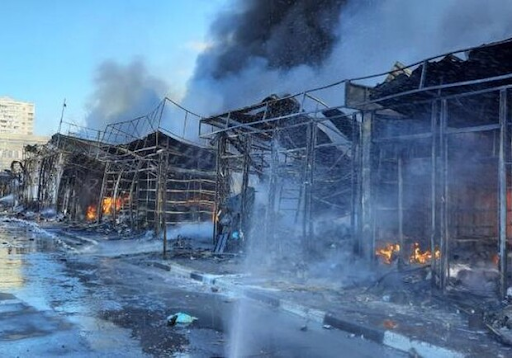 Rescue workers put out a fire at the market in the Heroiv Pratsi on March 16, 2022. (Image posted by vgorode.ua)
