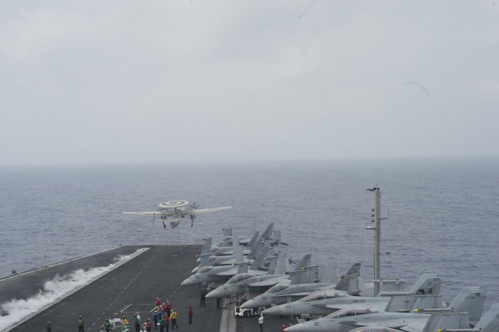An E2-C Hawkeye assigned to the Screwtops of Airborne Early Warning Squadron (VAW) 123 launches from the flight deck of the aircraft carrier USS Dwight D. Eisenhower (US Navy)