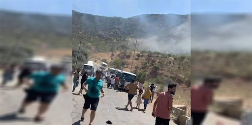Tourists run away from the site of alleged Turkish artillery shelling that hit a touristic site in Kurdistan Region’s Duhok province on July 17, 2022. (Image posted by Hawar News)