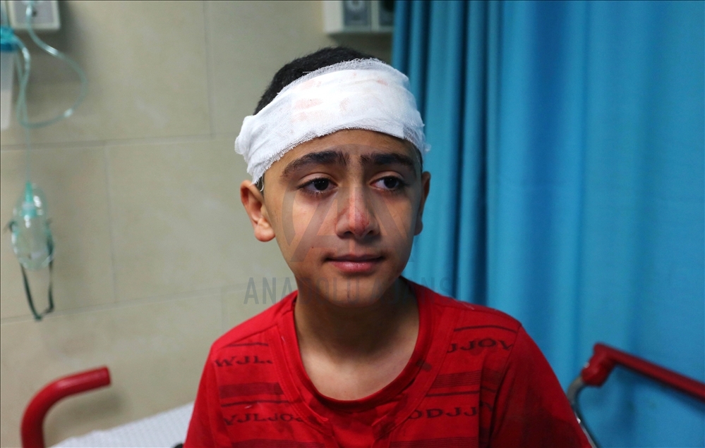Gazans injured in Israeli attack carried out to home of Palestinian Abu Khatab Familiy living in Al-Shati Camp in Gaza Strip, receive treatment at Shifa Hospital on May 15, 2021 (Image posted by Anadolu Agency)