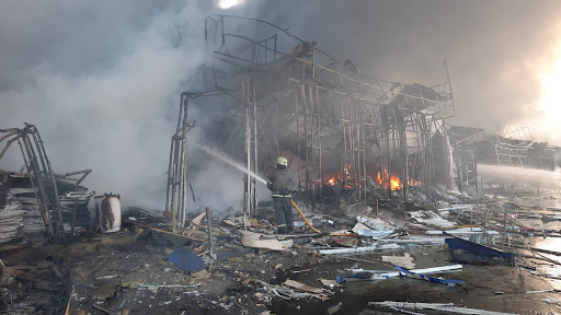 Rescue workers put out a fire at the market in the Heroiv Pratsi on March 16, 2022. (Image posted by DSNS via Telegram)