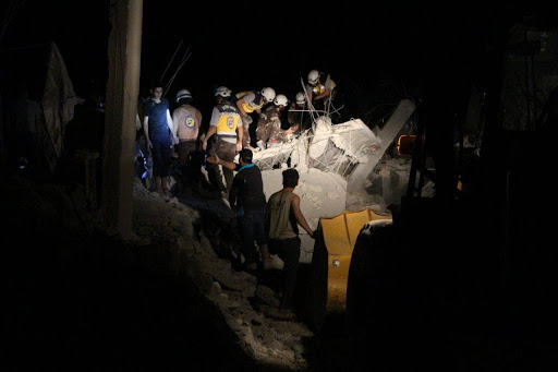 Syrian Civil Defense volunteers rescuing civilians and pulling bodies out of the rubble in Zardana after alleged Russian airstrikes on June 7th, 2020 (via SCD)