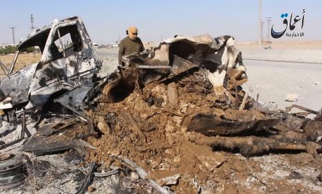 Image published by ISIL reportedly showing vehicle destroyed in 'coalition airstrike', May 26 2015