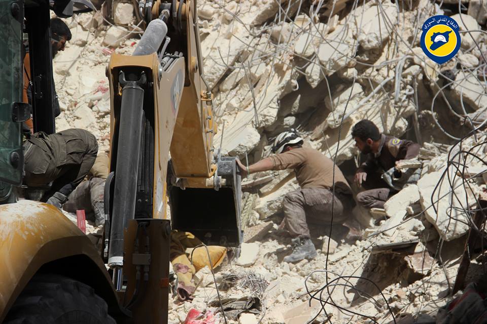 The civil defence working to rescue people from under the rubble after the aerial shelling of Al Quds hospital in al-Sukkari, Aleppo (via Aleppo White Helmets)